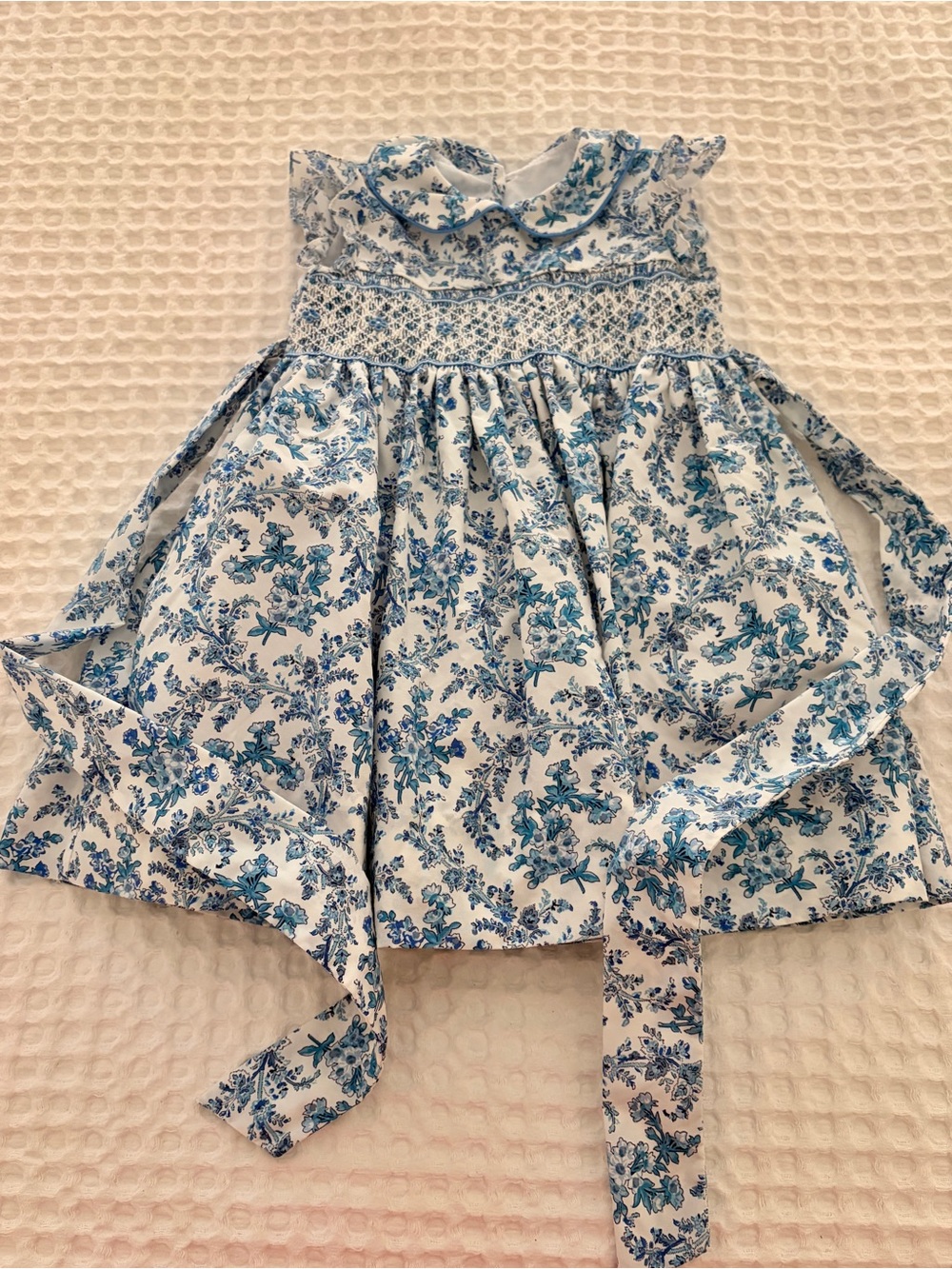 Anavini Blue Floral Hand Smocked Girls' Dress with Peter Pan Collar